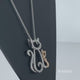 Load and play video in Gallery viewer, Jewelili Sterling Silver and 10K Rose Gold with Diamonds Cat Pendant Necklace
