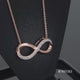Load and play video in Gallery viewer, Jewelili Rose Gold Over Sterling Silver With Natural White Diamonds Infinity Pendant Necklace
