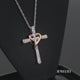 Load and play video in Gallery viewer, Jewelili 14K Rose Gold Over Sterling Silver With 1/10 CTTW Diamonds Heart Cross Pendant Necklace
