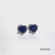Load and play video in Gallery viewer, Jewelili 10K White Gold with Heart Shape Created Blue Sapphire and 1/10 CTTW Natural White Round Diamonds Stud Earrings
