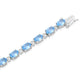 Load image into Gallery viewer, Jewelili Sterling Silver Oval Shape Swiss Blue Topaz and Natural white Round Diamond Accent Link Bracelet
