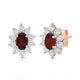 Load image into Gallery viewer, Jewelili 14K Rose Gold Over Sterling Sliver Oval Genuine Garnet and 1/20 CTTW Natural White Round Diamond Cluster Stud Earrings
