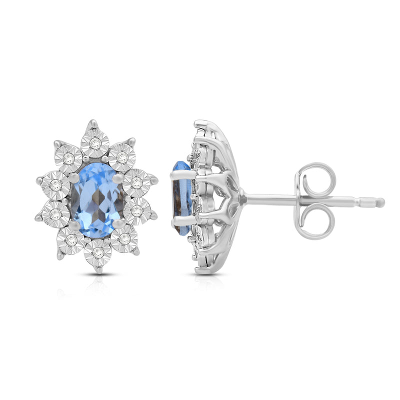 Jewelili Sterling Sliver 6x4 MM Oval Genuine Swiss Blue Topaz and 1/20 Cttw Natural White Round Diamond Cluster Stud Earrings