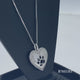 Load and play video in Gallery viewer, Jewelili Sterling Silver White Diamonds Dog Paw Printed Heart Pendant Necklace
