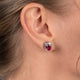 Load image into Gallery viewer, Jewelili Sterling Silver with Oval Shape Created Ruby and Natural White Round Diamonds Stud Earrings
