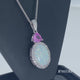 Load and play video in Gallery viewer, Jewelili Sterling Silver with Cabochon Oval Created Opal with Trill Created Pink Sapphire and Round Created White Sapphire Pendant Necklace
