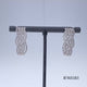 Load and play video in Gallery viewer, Jewelili Sterling Silver 1/2 CTTW Diamonds Crossover J-Hoop Earrings
