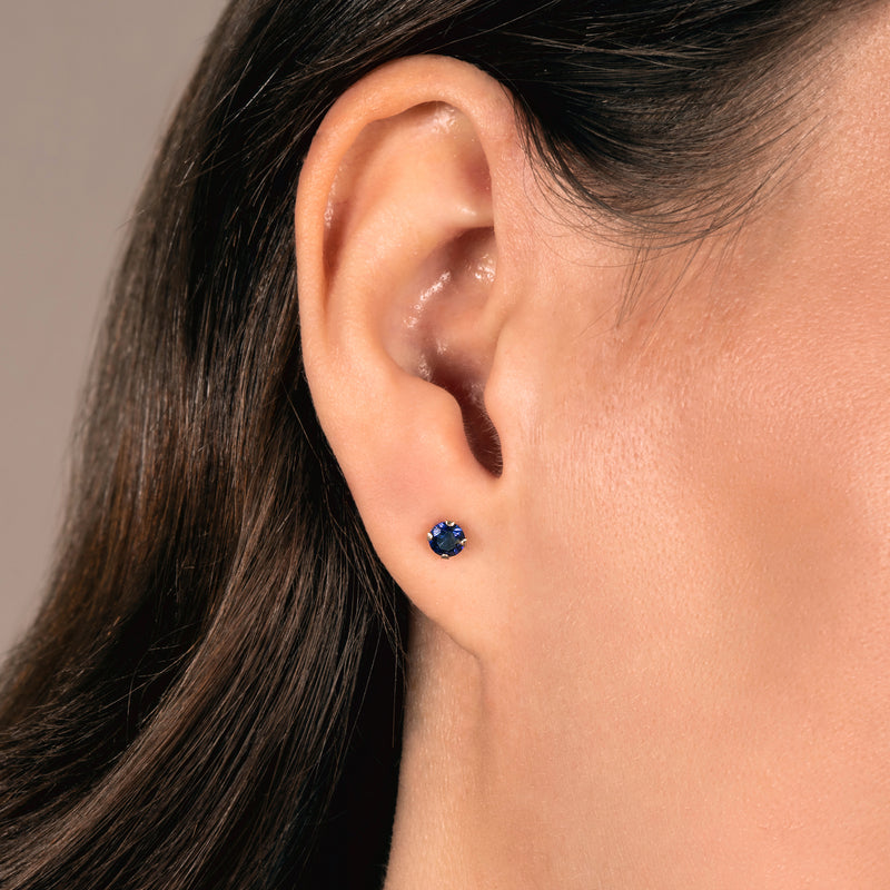 Jewelili Stud Earrings with Round Cut Created Blue Sapphire in 10K Yellow Gold view 1
