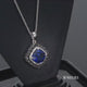 Load and play video in Gallery viewer, Jewelili Sterling Silver with Created Blue Sapphire and Treated Black and Natural White Round Diamonds Pendant Necklace
