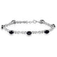 Load image into Gallery viewer, Jewelili Bracelet with Oval Shape Onyx and Created White Sapphire in Sterling Silver 7 x 5 mm 7.25&quot;

