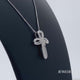 Load and play video in Gallery viewer, Jewelili Sterling Silver With 1/4 CTTW Natural White Diamond Cross Pendant Necklace
