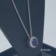 Load and play video in Gallery viewer, Jewelili Sterling Silver with Round Created Blue and White Sapphire Halo Pendant Necklace
