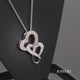 Load and play video in Gallery viewer, Jewelili Sterling Silver With Diamonds Double Heart Pendant Necklace
