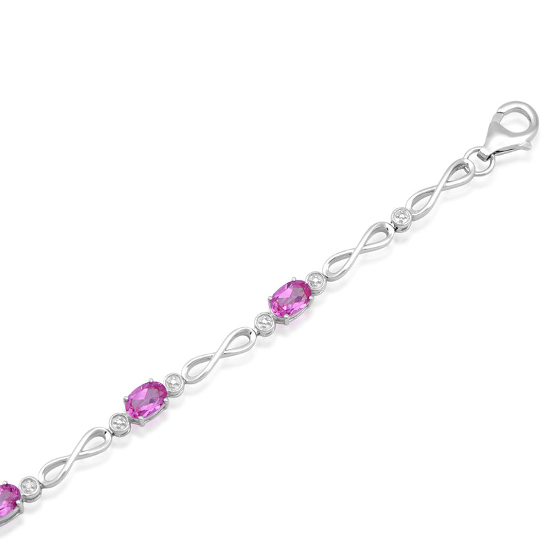 Jewelili Link Bracelet with Oval Created Pink Sapphire and Natural White Round Diamonds in Sterling Silver 6x4 MM View 1