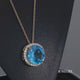 Load and play video in Gallery viewer, Jewelili 10K Yellow Gold With Round Swiss Blue Topaz and Created White Sapphire Halo Pendant Necklace

