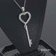 Load and play video in Gallery viewer, Jewelili Sterling Silver With 1/10 CTTW Diamonds Heart Key Pendant Necklace
