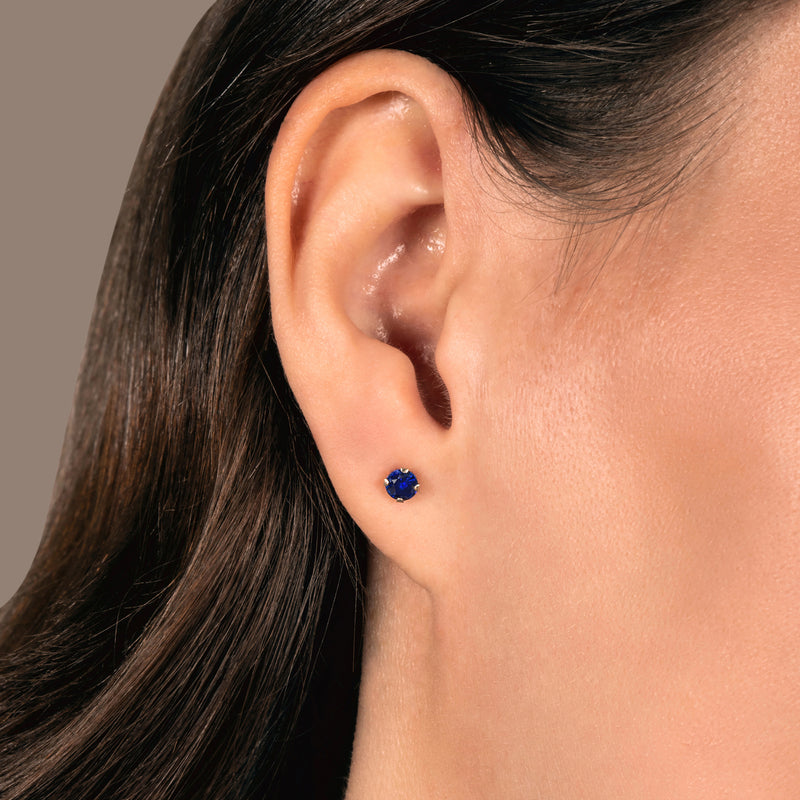 Jewelili 10K Yellow Gold With Round Cut Created Blue Sapphire Stud Earrings