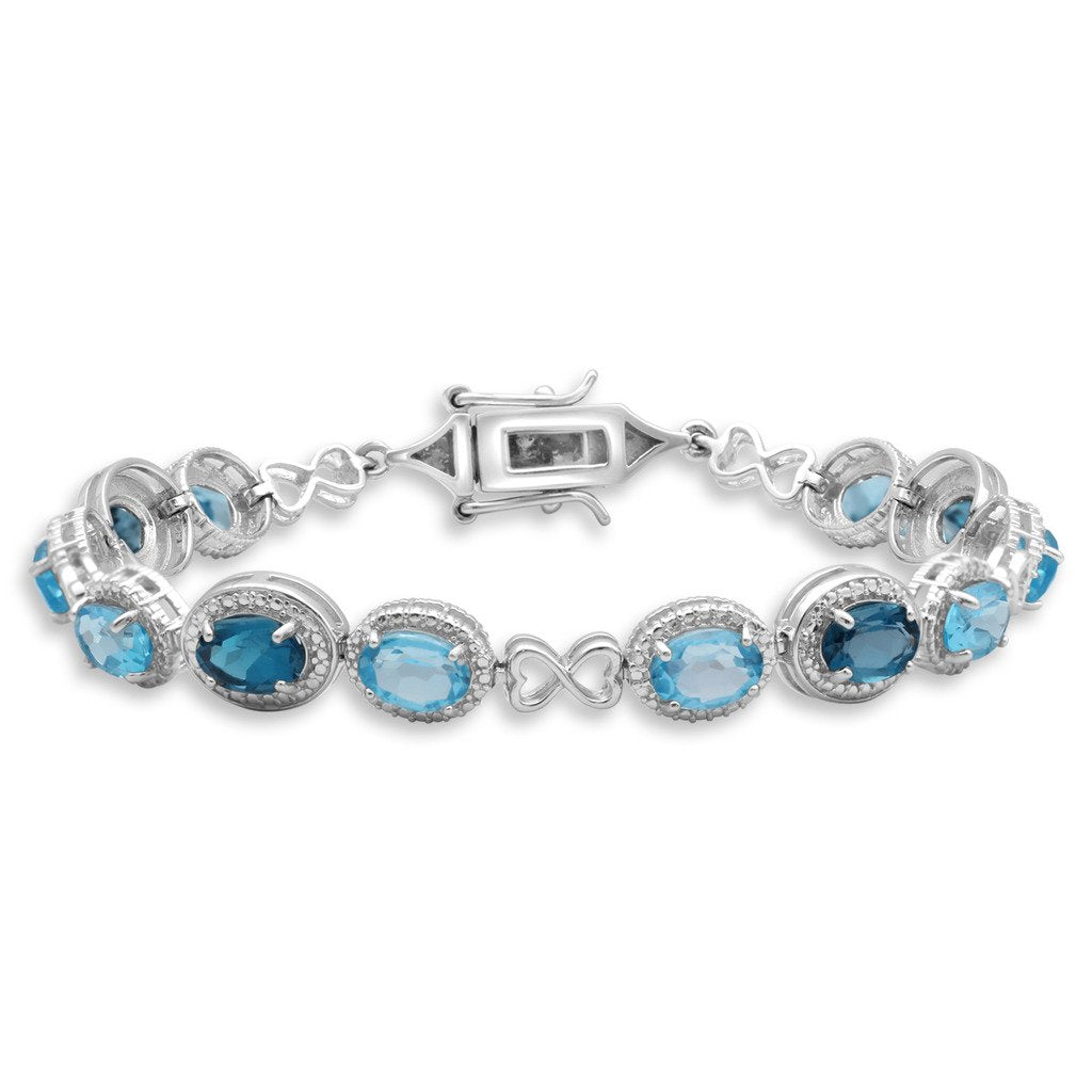 Jewelili Tennis Bracelet with Oval Swiss & London Blue Topaz and Round White Diamonds in Sterling Silver View 1