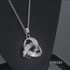 Load and play video in Gallery viewer, Jewelili Sterling Silver With 1/10 CTTW Natural White Diamond Love Knot Pendant Necklace
