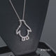 Load and play video in Gallery viewer, Jewelili Sterling Silver Natural White Round Diamonds Penguin Pendant Necklace

