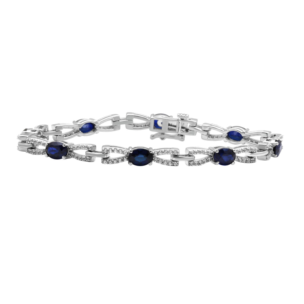 Jewelili Swirl Tennis Bracelet with Oval Created Blue Sapphire & Round Created White Sapphire in Sterling Silver