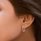 Load image into Gallery viewer, Jewelili Hoop Earrings with Natural White Round Diamonds in Sterling Silver 1/4 CTTW View 4

