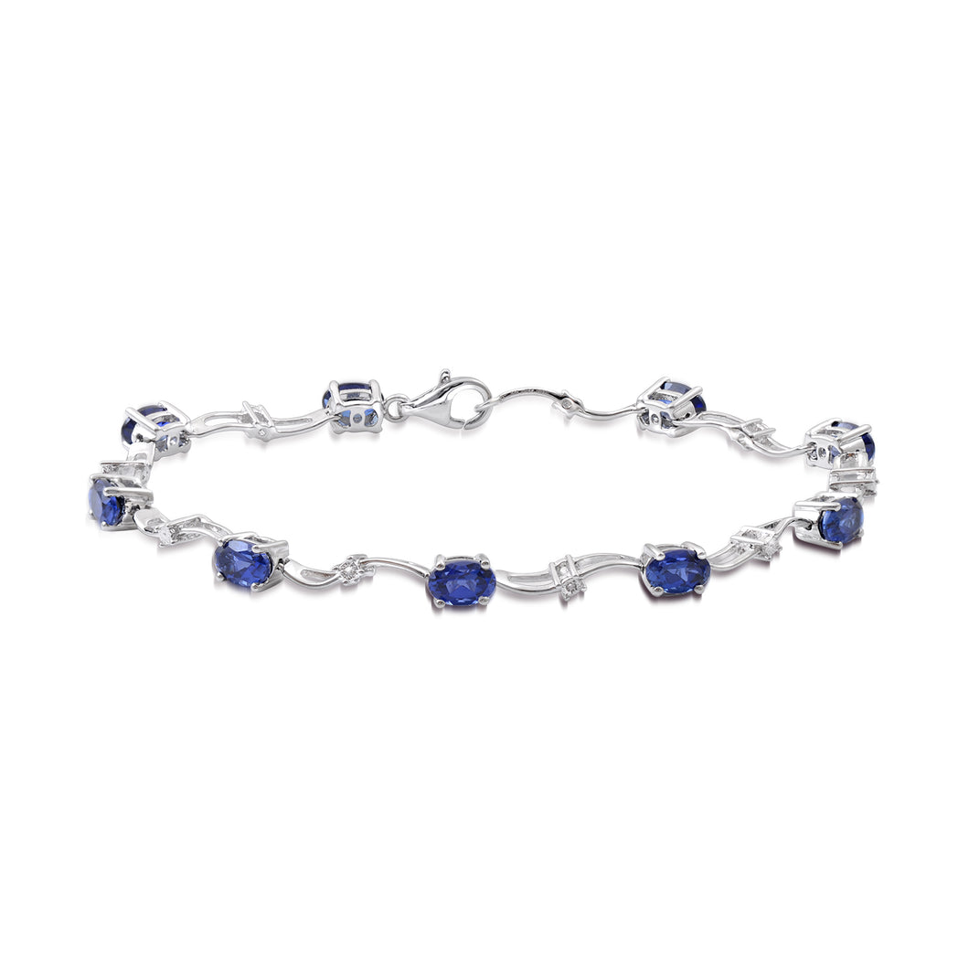 Jewelili Bracelet with Oval Shape Created Blue Sapphire and White Diamonds in Sterling Silver 6 x 4 mm 7.25 inches