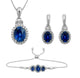 Load image into Gallery viewer, Jewelili Sterling Silver with 8x6MM 7x5MM and 6x5MM Oval Shape Created Ceylon Sapphire with Baguette and Round Created White Sapphire Bolo Bracelet Dangle Earrings and Pendant Necklace, 18&quot; Box Chain
