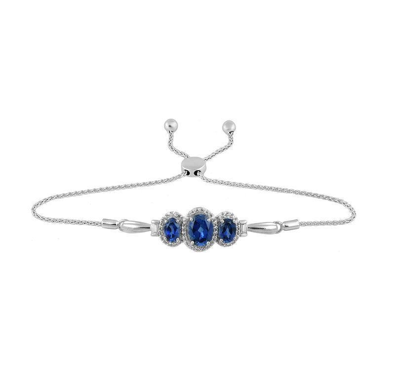 Jewelili Sterling Silver with 8x6MM 7x5MM and 6x5MM Oval Shape Created Ceylon Sapphire with Baguette and Round Created White Sapphire Bolo Bracelet Dangle Earrings and Pendant Necklace, 18" Box Chain