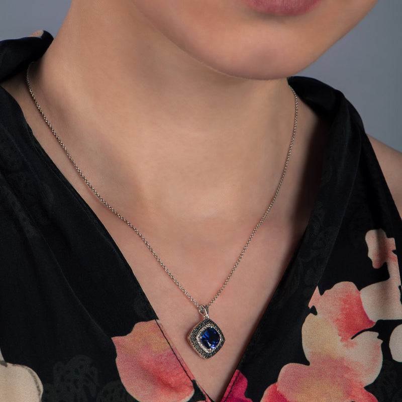 Jewelili Sterling Silver with Created Blue Sapphire and Treated Black and Natural White Round Diamonds Pendant Necklace