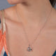 Load image into Gallery viewer, Jewelili Sterling Silver With 1/10 CTTW Natural White Diamond Love Knot Pendant Necklace

