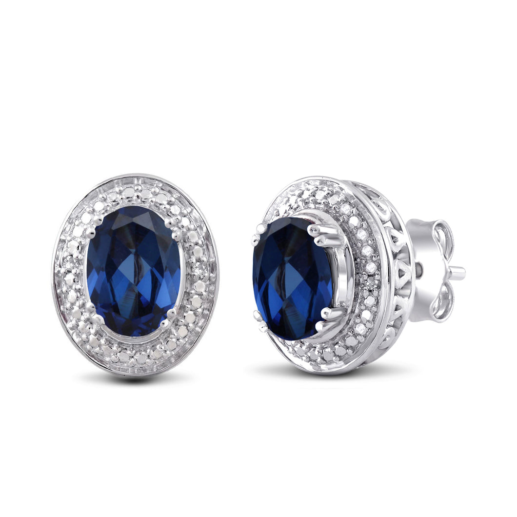 Jewelili Sterling Silver with Oval Shape Created Blue Sapphire and Natural White Round Shape Diamonds Stud Earrings