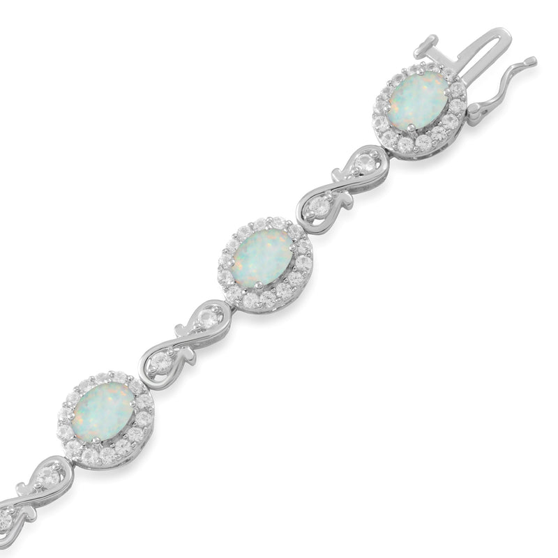 Jewelili Fashion Bracelet with Oval Shape Created Opal and Created White Sapphire in Sterling Silver 7 x 5 mm 7.25" View 1