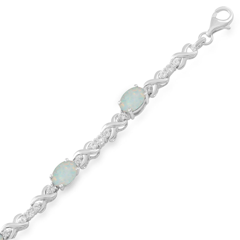 Jewelili Bracelet with Oval Shape Created Opal and Created White Sapphire in Sterling Silver 7x5 MM View 1