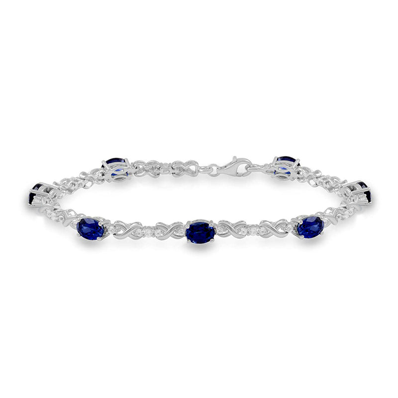 Jewelili Sterling Silver 7x5 mm Oval Shape Created Blue Sapphire and Created White Sapphire Bracelet
