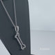 Load and play video in Gallery viewer, Jewelili Sterling Silver With 1/6 CTTW Natural White Diamond Bone Pendant Necklace

