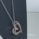 Load and play video in Gallery viewer, Jewelili 10K Rose Gold Over Sterling Silver with 1/10 CTTW Diamonds Heart Shape Pendant Necklace
