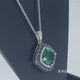 Load and play video in Gallery viewer, Jewelili Sterling Silver with Cushion Created Emerald and Treated Black and White Diamonds Pendant Necklace
