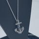 Load and play video in Gallery viewer, Jewelili Sterling Silver With 1/5 CTTW Treated Blue and Natural White Diamonds Anchor Pendant Necklace
