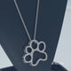 Load and play video in Gallery viewer, Jewelili Sterling Silver With Natural White Diamonds Dog Paw Pendant Necklace
