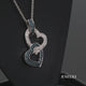 Load and play video in Gallery viewer, Jewelili Sterling Silver With 1/6 CTTW Treated Blue Diamonds and White Round Diamonds Double Heart Pendant Necklace
