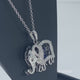 Load and play video in Gallery viewer, Jewelili Sterling Silver with Heart Shape Blue Spinal and Round Created White Sapphire Elephant Pendant Necklace
