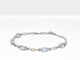 Load and play video in Gallery viewer, Jewelili Sterling Silver With Swiss Blue Topaz Oval Bracelet
